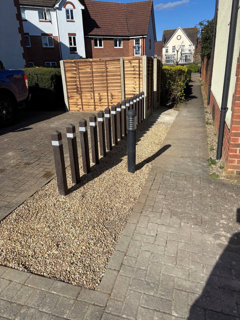 Recycled Plastic bollards next to parking space