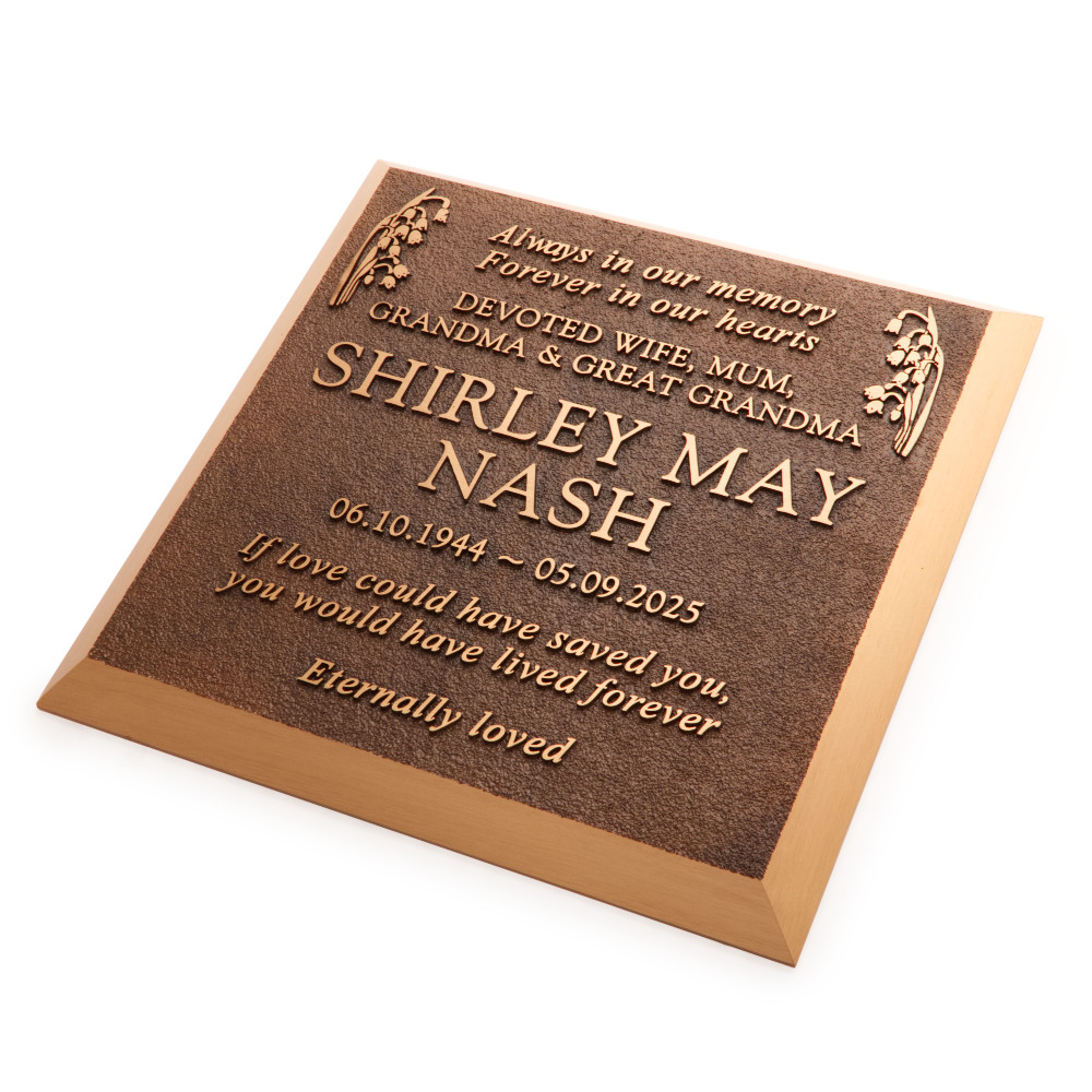 Aged bronze plaque for a lawn