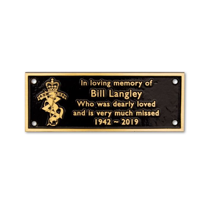 Black cast bronze memorial plaque with gold writing and logo