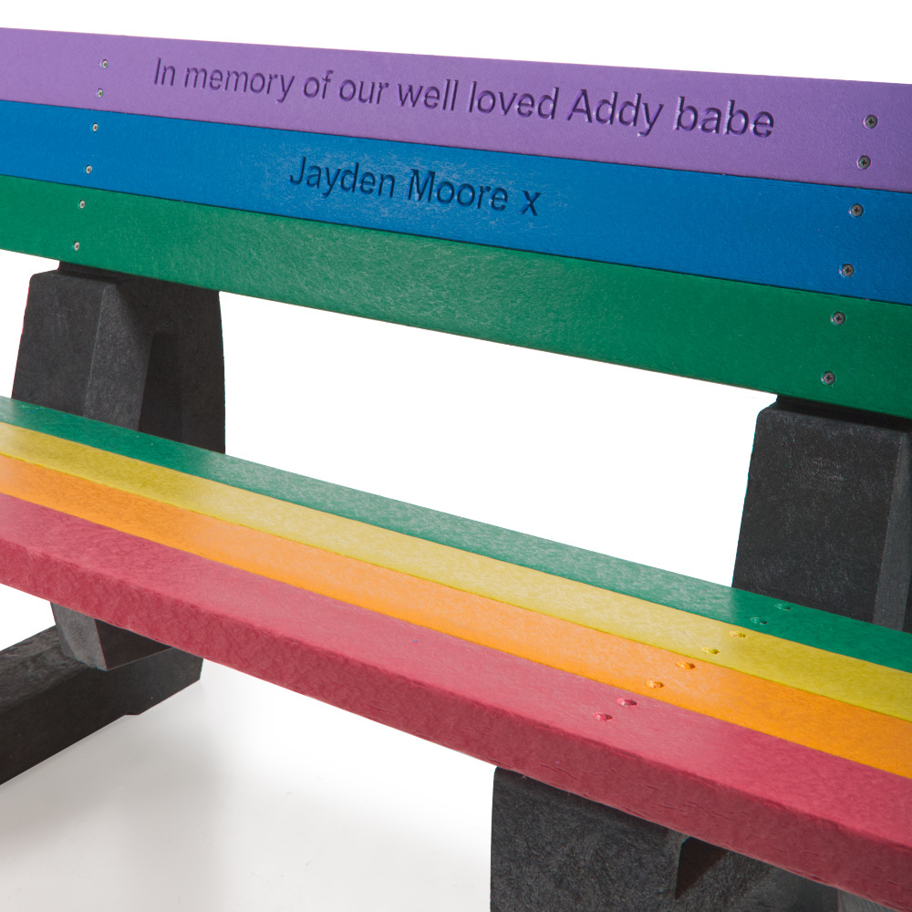 Rainbow coloured recycled plastic seat with engraved text
