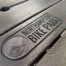 Engraved recycled plastic picnic table with company logo.