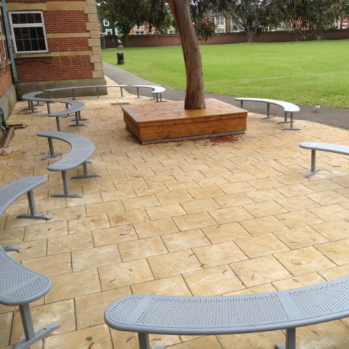 Curved steel benches on paving slabs