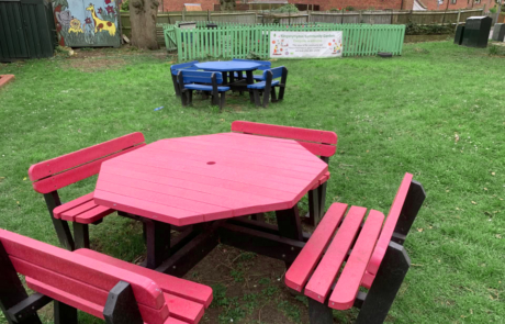 Red Octagonal Picnic Tables With Backrests'