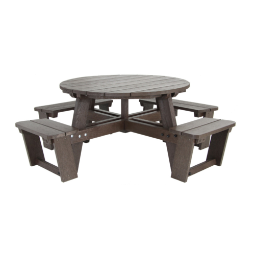 Brown round picnic table with seats attached and space for a wheelchair
