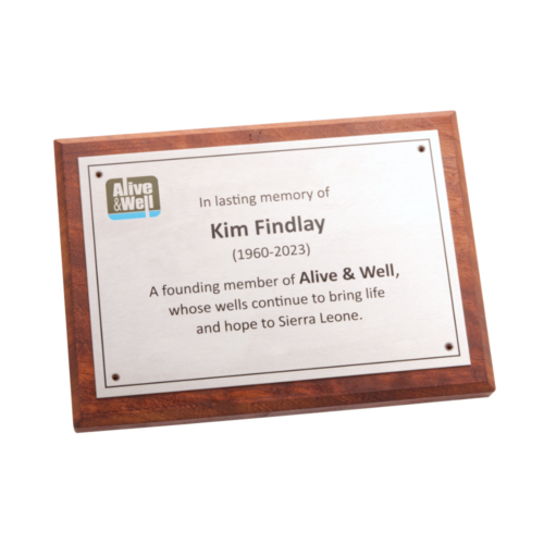 Stainless steel commemorative plaque on iroko backing plate.