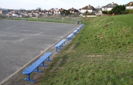 Vardeen-School-Brighton-1 Steel benches in a row next to a grass verge in a school playground