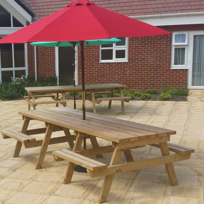Wooden A frame tables with wheelchair access and parasols