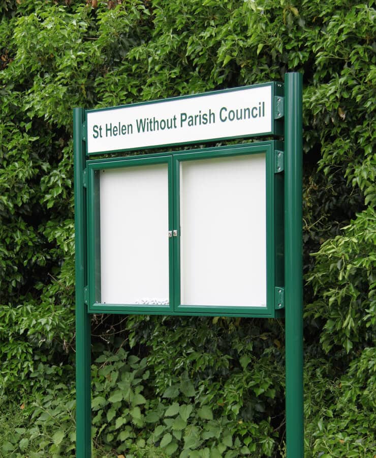 home-panel-noticeboards-1 Green framed notice boards on posts with header board showing parish name in green writing